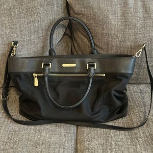 Laptop bag with multiple interior pockets and one external zipper pocket.